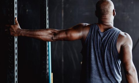 Man stretching his chest bicep