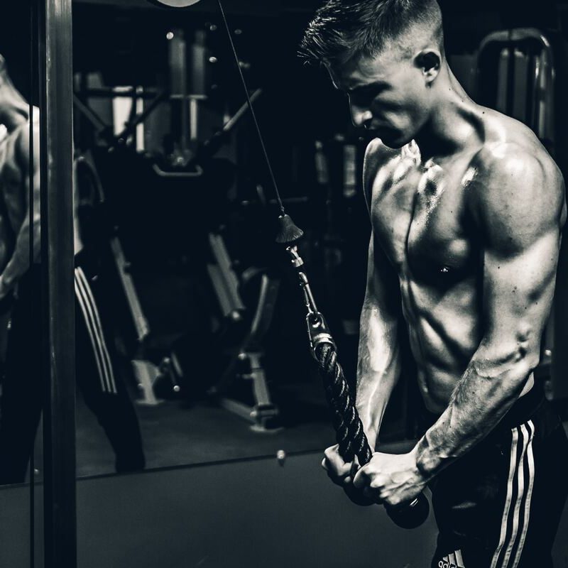 Man in the gym working out his triceps