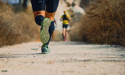 Man running on trail.