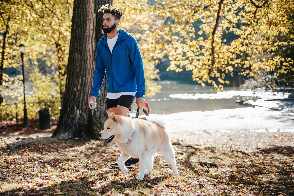 Man walking his dog.