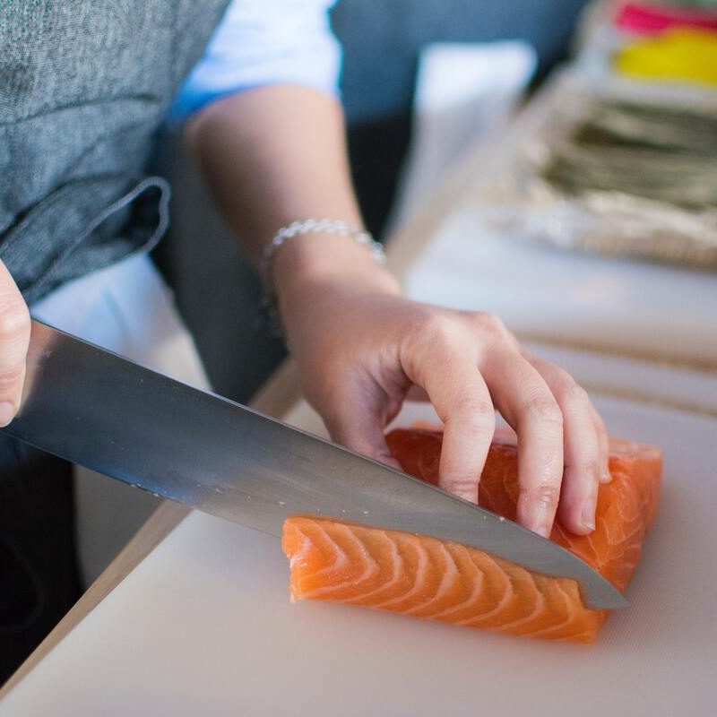 Person slicing salmon