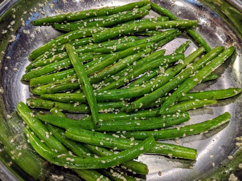 green beans sauteing in a pan