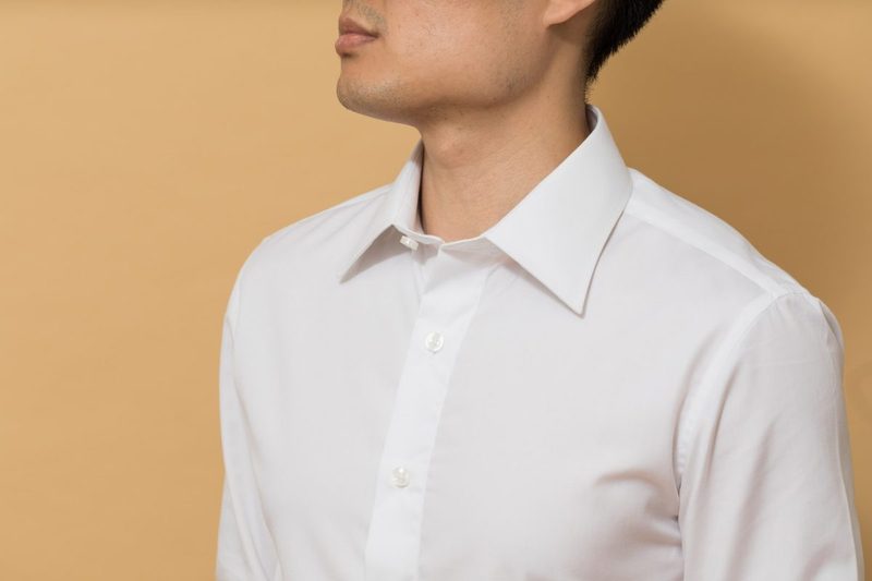 A man in a white button up dress shirt.