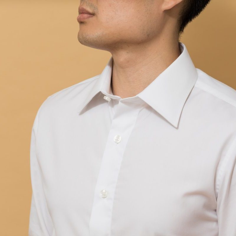 A man in a white button up dress shirt.
