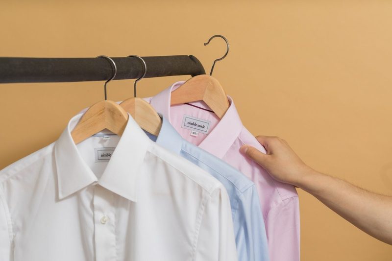 Button up shirts on hangers.