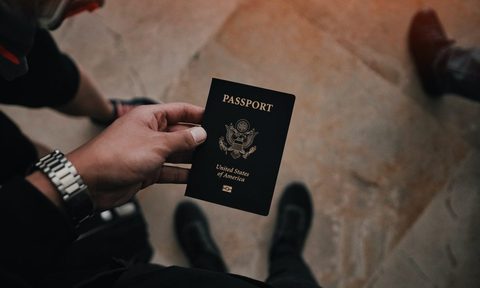 A person holding a passport