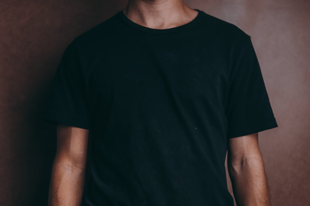 A person wearing a black T-shirt.