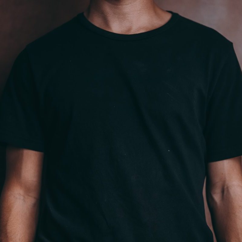 A person wearing a black T-shirt.