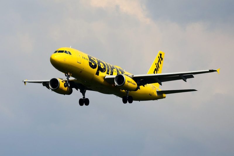 A Spirit Airlines plane in the air.
