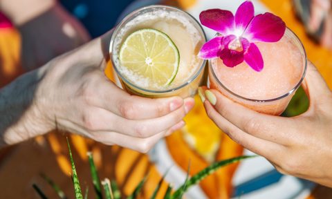 A toast with two Sure Sure cocktails