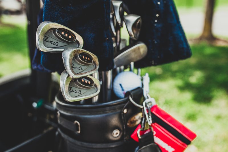 Wedges in a golf bag.