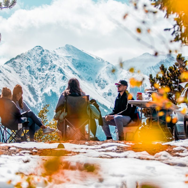 People sitting around a campground.