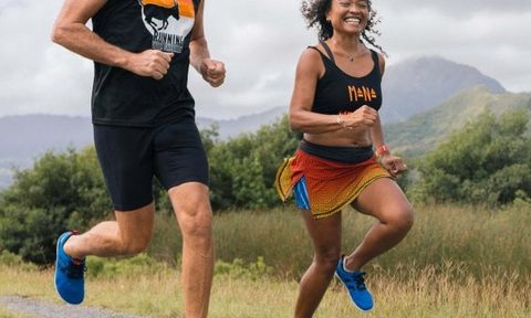 Two people running in barefoot shoes on the trail