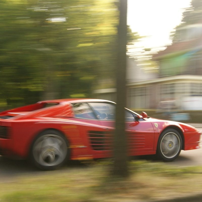 Red 1991 Ferrari Testarossa in motion