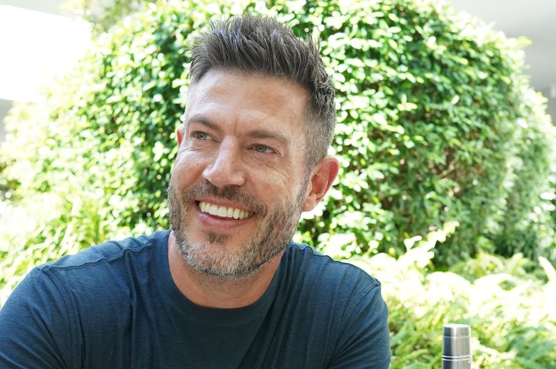 "The Bachelor" host Jesse Palmer at home with TINCUP whiskey.