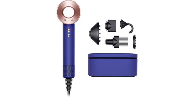 The Dyson Supersonic Hair Dryer with all its attachments next to it.