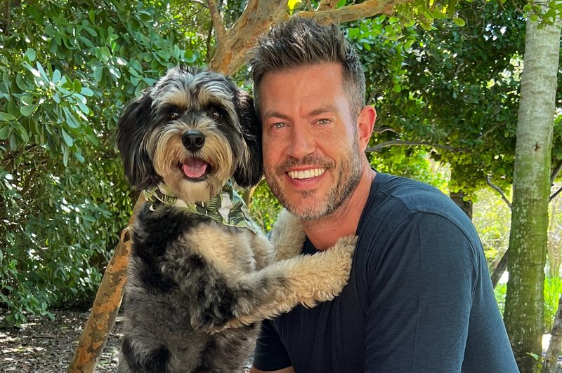 "The Bachelor" host Jesse Palmer at home with TINCUP whiskey and a special friend.