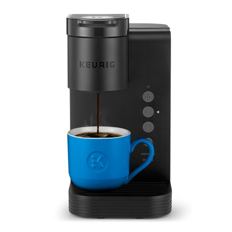 The Keurig K-Express Essentials coffee maker pouring into a blue mug.