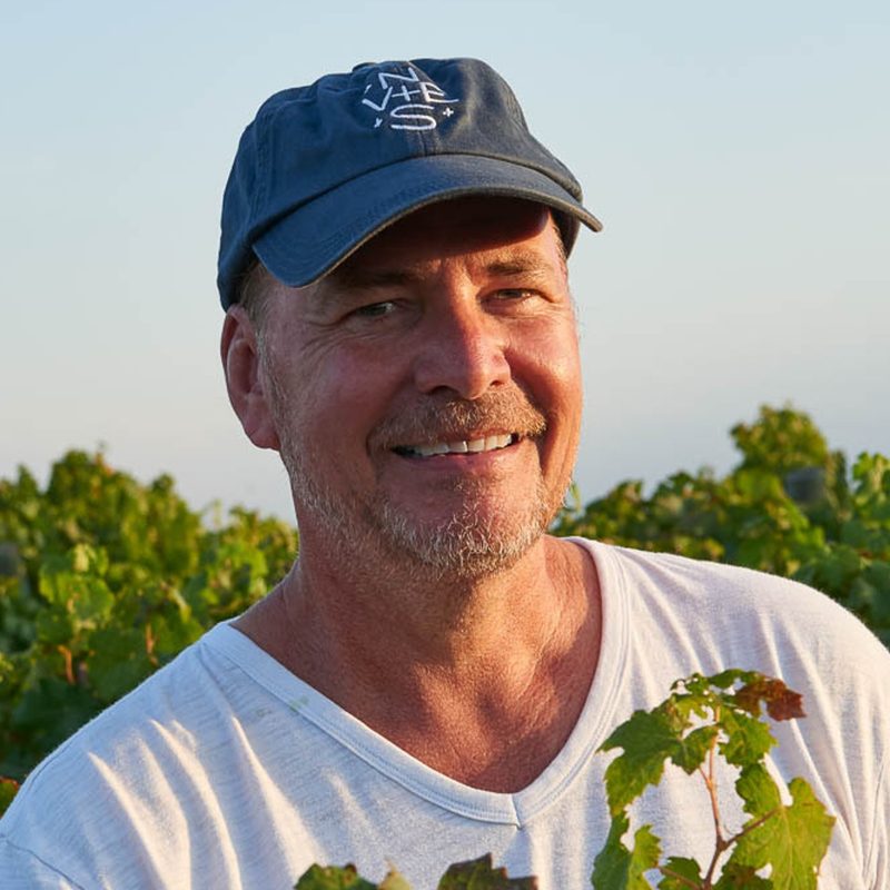 A portrait of The Vines Global founder and CEO Michael Evans.