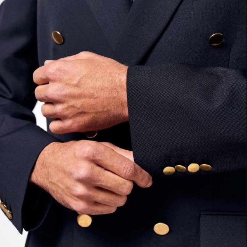 Man fixing sleeves of a Joseph Turner blazer