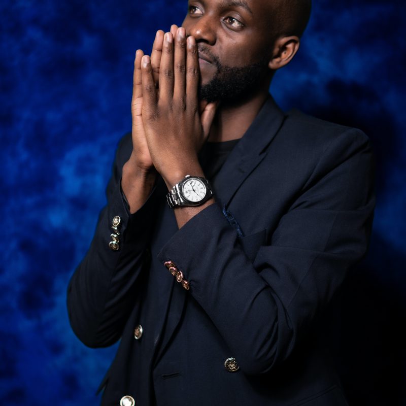 Man in an unbuttoned navy blazer