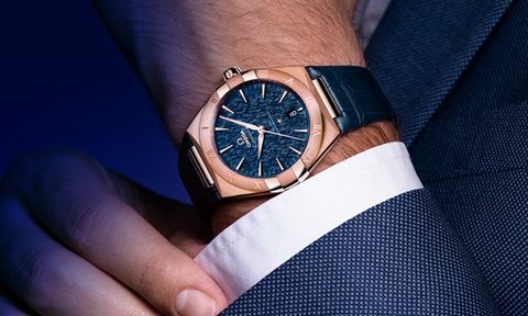 Man in suit wearing an Omega