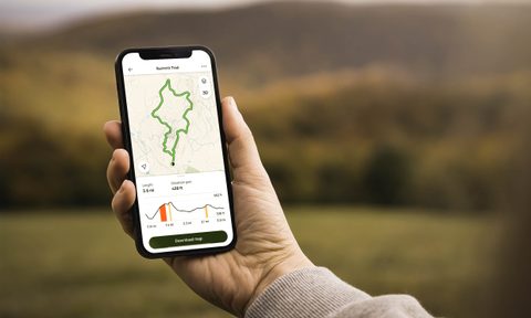 A person holding a phone with the AllTrails Maps details.