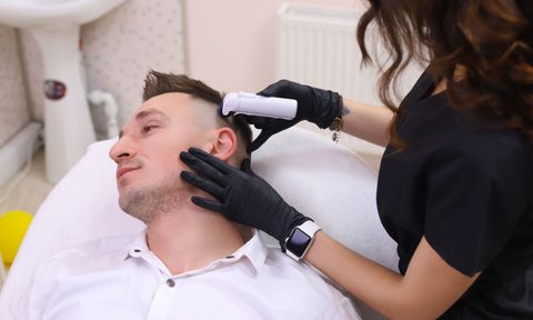 Man getting micro-needling treatment.