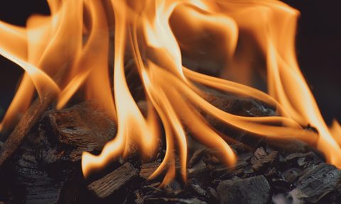 Flames from a charcoal grill.