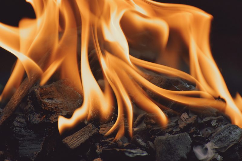 Flames from a charcoal grill.
