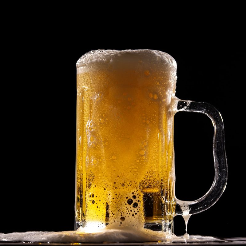 Glass of beer with a black background
