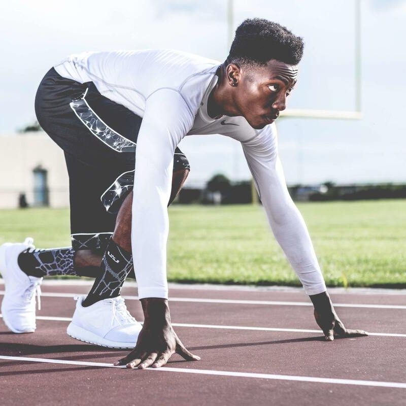 Man running on track.