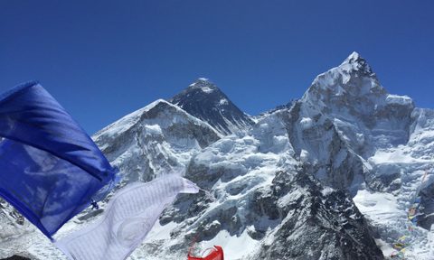 Mount Everest with prayer flags in the foreground