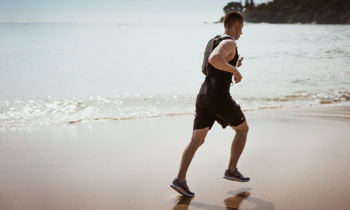 a man running on the beach