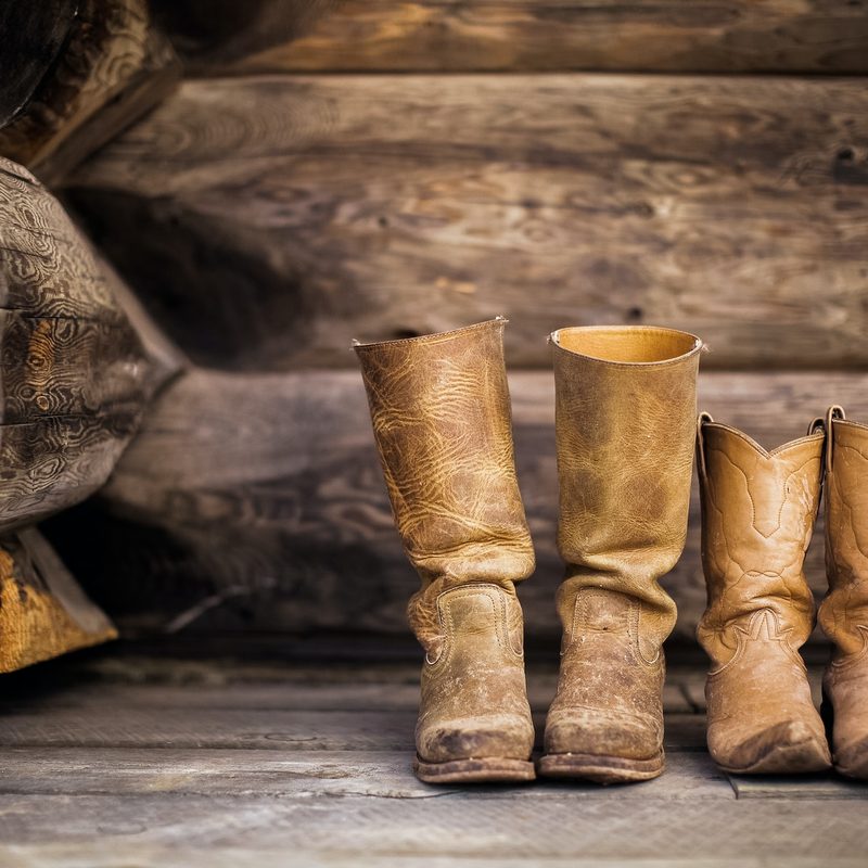 Cowboy boots on a wooden porch