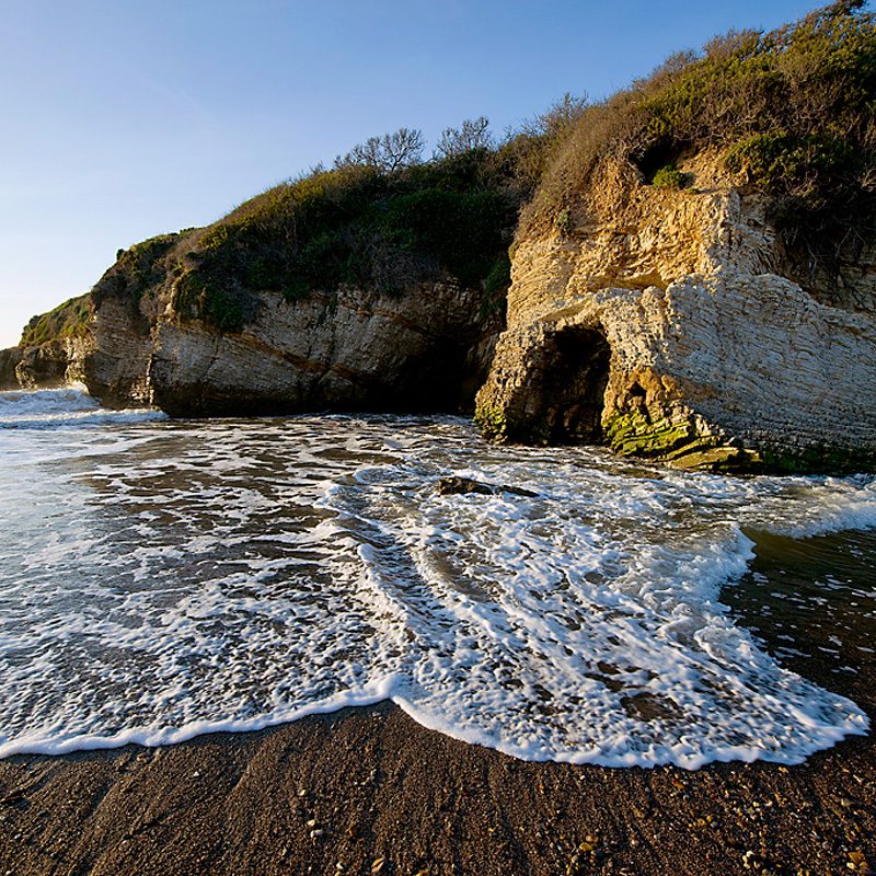 Surf crashing on the shore at Montaña de Oro State Park in San Luis Obispo, California.