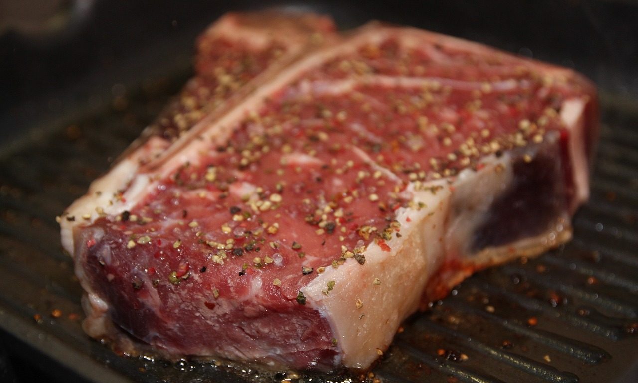 Cut of steak on a grill.
