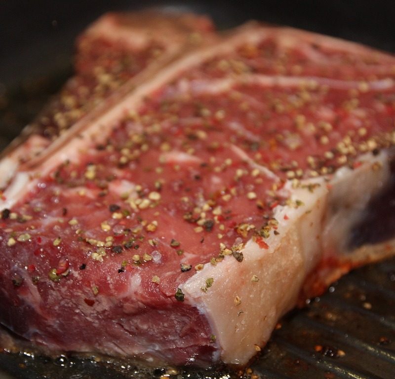 Porterhouse steak on a grill