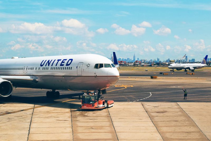 A United Airlines airplane on the ground at the airport.