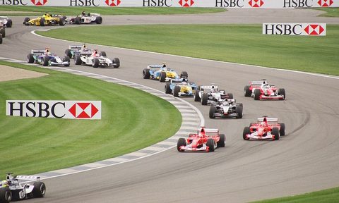 Formula 1 cars winding their way down a track.