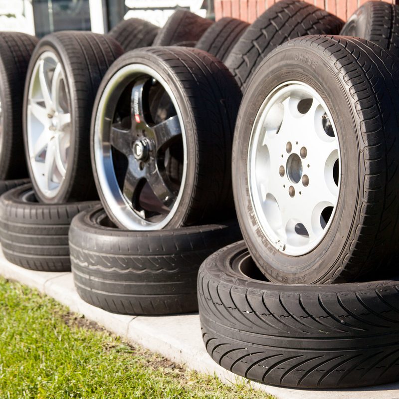 A line of new tires ready to be equipped to vehicles.