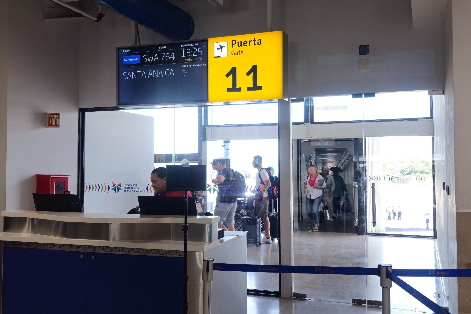 A group of passengers navigate the gate at Licenciado Gustavo Díaz Ordaz International Airport in Puerto Vallarta, Jalisco, Mexico.
