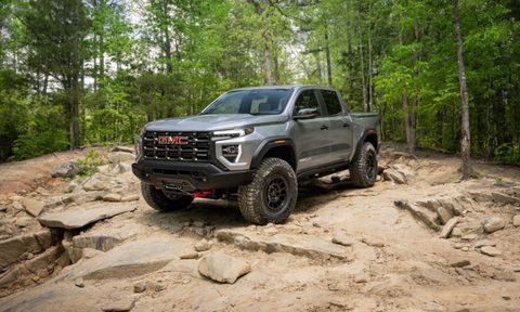 The 2024 GMC Canyon AT4X AEV Edition parked on an offroad terrain.