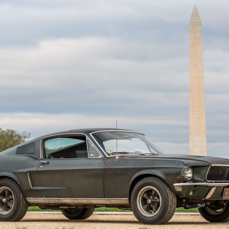 The green1968 Mustang GT from the movie Bullitt in front of the Washington Monument