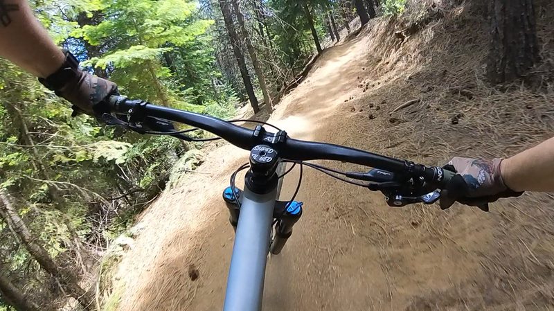 Catching some final corners on the mountain bike trail with the Insta360 X3