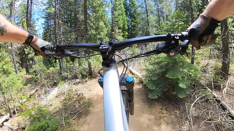 Using the Insta360 X3 to capture an airborne moment on a mountain bike trail