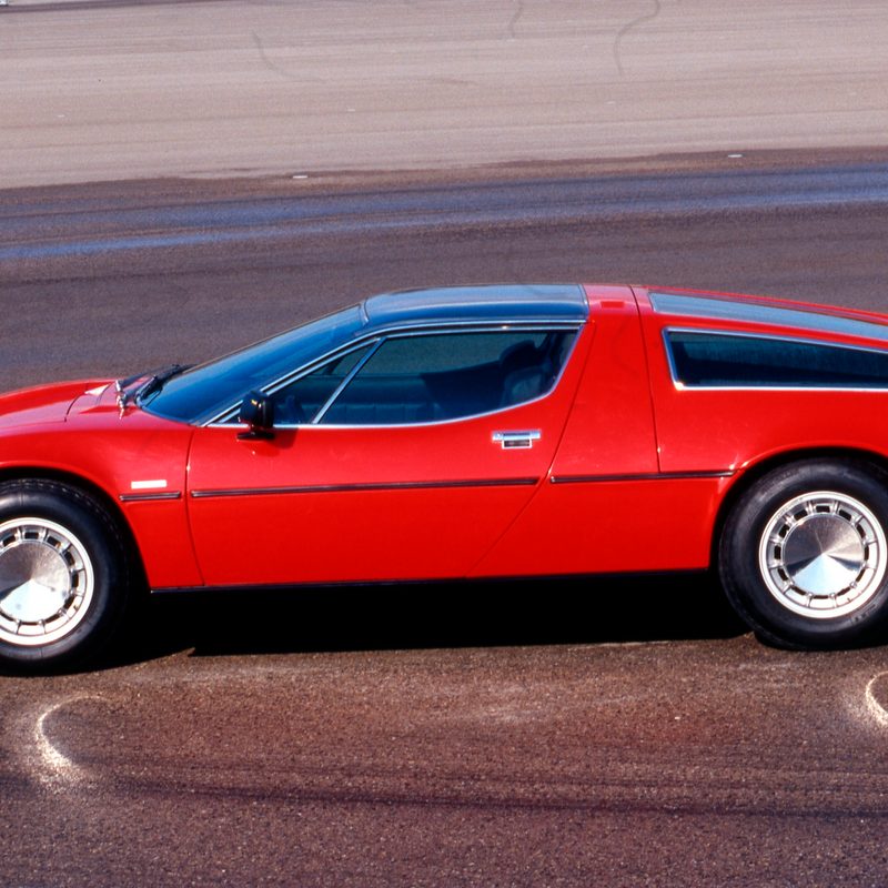 A red Maserati Bora on a wet trach