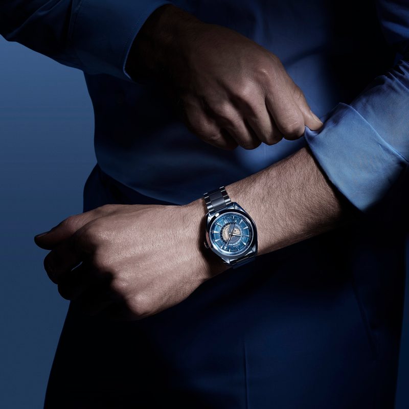 Man's wrist wearing an Omega Seamaster watch