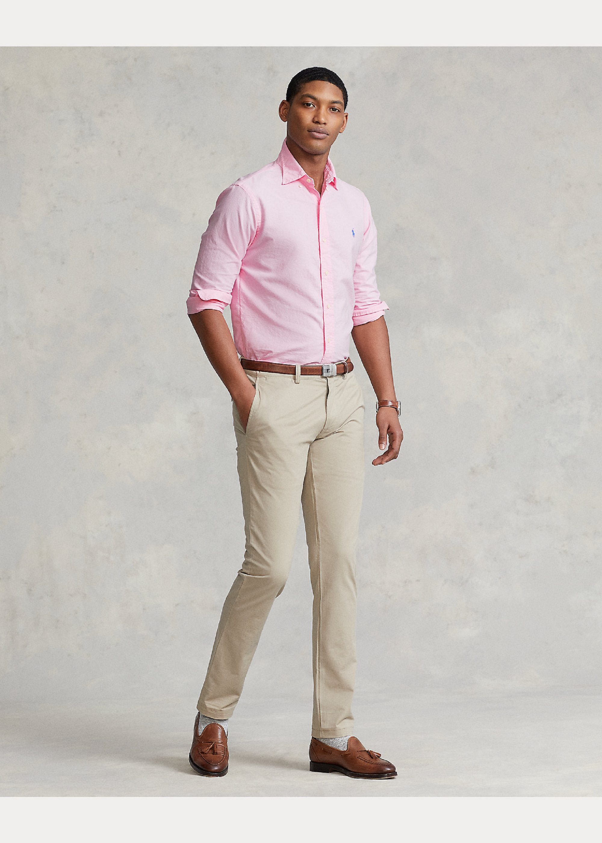 Man in pink Ralph Lauren button down with khaki pants