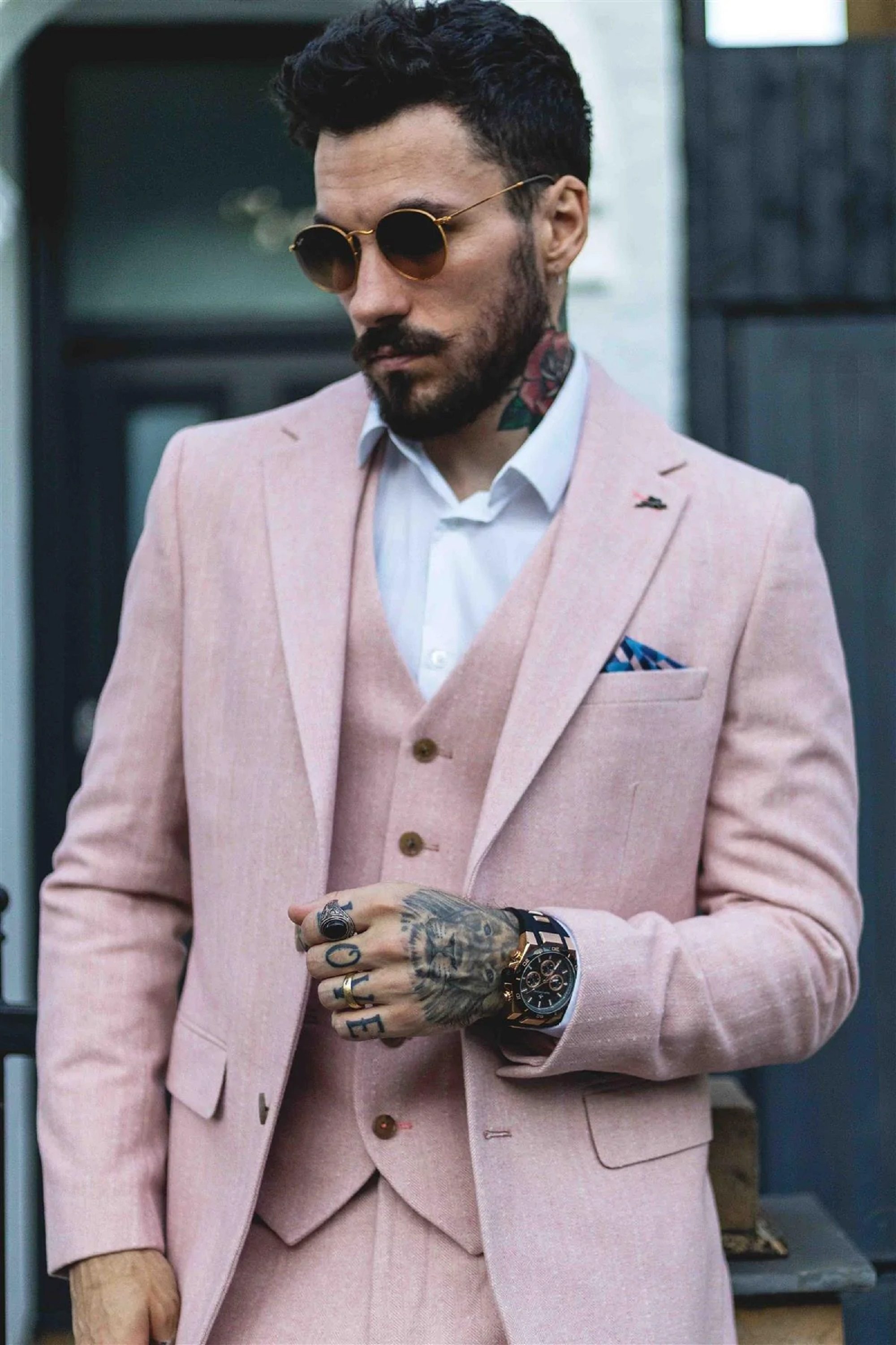 Man in formal pink suit with matching vest